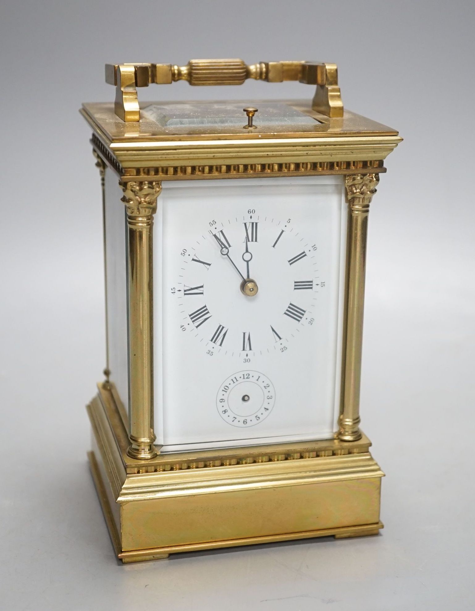 A large late 19th century brass carriage clock with alarm, and push repeat, 15 cms high.